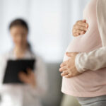 Abortion Limits Loosen—Europe Feels The Jolt Pregnant person holding their belly during a medical visit
