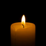 Candle flame glowing in the dark
