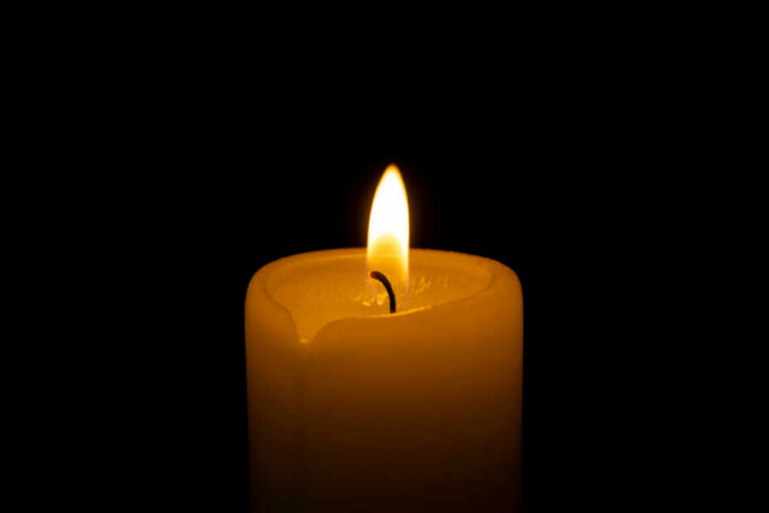 Candle flame glowing in the dark