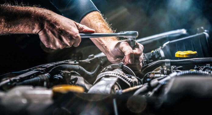 Auto,Mechanic,Working,On,Car,Engine,In,Mechanics,Garage.,Repair