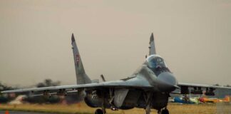 F-16 fighter jet on an airbase during sunset