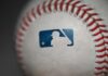 Rangers Skip Pride Night — Activists Furious Close-up of a baseball featuring the MLB logo