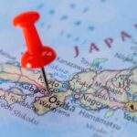 American Vanishes in Japan—Trail Goes Dark A close-up of a map of Japan with a red pushpin marking Osaka
