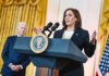 Optics Nightmare: Harris’ Malibu Gamble Two people speaking at a podium with microphones.