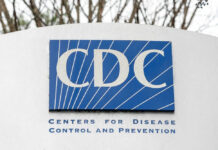 Stomach Bug Spreads, Officials Withhold Details CDC sign on an outdoor monument