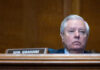 Shock Exit Triggers High-Stakes Senate Scramble Man sitting at a desk with nameplate Sen Graham