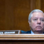 Shock Exit Triggers High-Stakes Senate Scramble Man sitting at a desk with nameplate Sen Graham