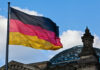 Missile Shield EXPANDS: Berlin Goes Exoatmospheric German flag waving against a blue sky near a historic building
