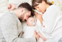 Rich Couple Hires Bedtime Squad Parents sleeping beside newborn baby
