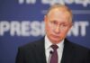Kremlin Meltdown Over Seoul–NATO Link man in suit at podium with microphone