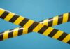 UK Events Brace: Cars Turned Into Weapons caution tape crossing on blue background