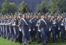 military cadets marching in formation with rifles