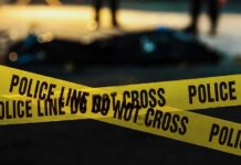 yellow police tape at a nighttime crime scene