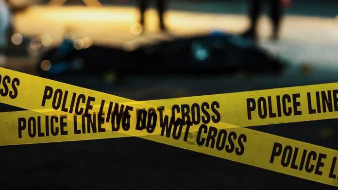 yellow police tape at a nighttime crime scene