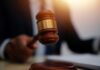 Fifth Circuit Shields Shooter — Families Silenced A gavel being struck on a desk in a courtroom setting