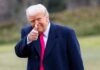 Judges’ Power Grab Meets Instant Trump Reversal A man in a dark coat and pink tie giving a thumbs up outdoors