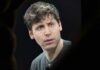 A man with a thoughtful expression during a conference
