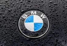 China Undercuts BMW — Thousands Axed BMW hood emblem with raindrops