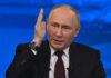 Energy Lifeline Squeezed — Putin’s Cash At Risk man in suit speaking with raised hand
