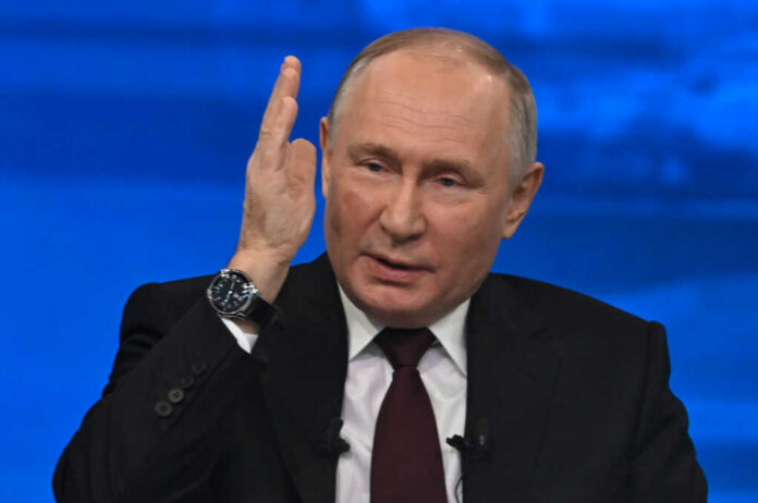 vladimir-putin-speaks2529435889jpg man in suit speaking with raised hand