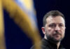 Ukraine War Cabinet Meltdown—Reformer Pushed Out Person with short hair next to blurred yellow flag
