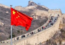 Walk Away From China? Rubio Slams ‘Reckless’ Move Chinese flag waving with the Great Wall in the background