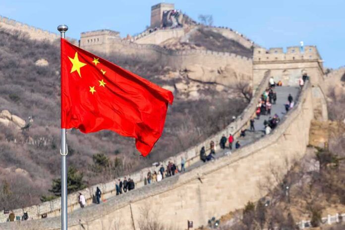 Chinese flag waving with the Great Wall in the background