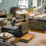 industrial scale with white powder in a cluttered warehouse