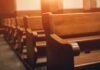 OnlyFans In The Pews—Backlash Explodes Wooden church pews in warm sunlight