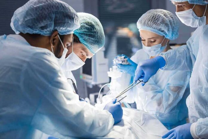 shutterstock_1265400856 surgeons performing an operation