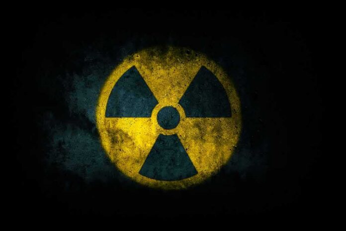 radiation hazard symbol on dark textured background
