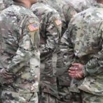 Soldiers in camouflage uniforms standing in formation
