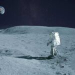 Lunar Gold Rush? NASA Data Points The Way Astronaut walking on the Moon with Earth in the sky
