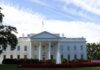 White House with front fountain and flag