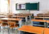 Classrooms Expose Communism’s Grim Playbook Empty classroom with rows of desks and a chalkboard