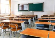 Classrooms Expose Communism’s Grim Playbook Empty classroom with rows of desks and a chalkboard