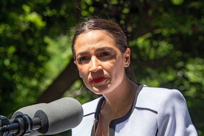 shutterstock_1986192116 woman speaking at an outdoor microphone
