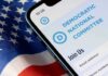Big Donors Walk—DNC War Chest Evaporates Smartphone showing a political committee webpage on an American flag