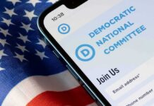 Big Donors Walk—DNC War Chest Evaporates Smartphone showing a political committee webpage on an American flag