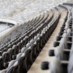 Empty stadium seats in curved rows
