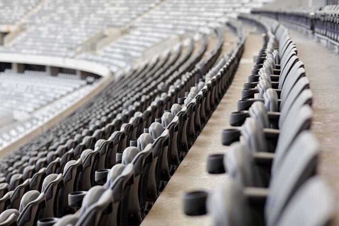 shutterstock_254951527 Empty stadium seats in curved rows