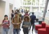 Donor Kids’ Shortcut? Congress Loads the Trap Students walking through a bright campus atrium using mobile devices