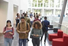 Donor Kids’ Shortcut? Congress Loads the Trap Students walking through a bright campus atrium using mobile devices