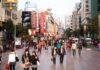 China’s Housing Reset: Drops The Hammer On Presales Crowded shopping street with pedestrians and storefronts