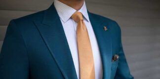 Teal suit jacket with gold tie