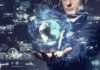 Businessperson holding a digital globe with data interfaces