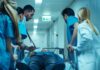 Checkpoint Carnage Hits Ambassador’s Son Medical team rushing patient on a gurney through hospital corridor
