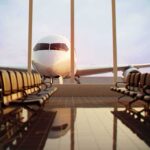 Birds Trigger Citywide Alarms – Jets Launch Airplane seen through terminal windows with empty gate seating