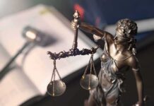 Ivy League Shock: Frat Ketamine Claims Rock Campus Lady Justice statue holding balanced scales