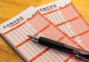 Powerball lottery play slips with a black pen